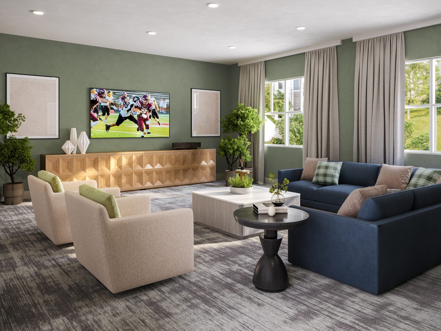 a living room with a large flat screen tv and couches at The  Preserve at Sycamore Creek